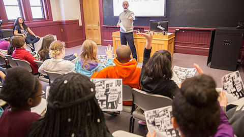 Brett Flehinger, lecturer on history, gives a presentation to seventh-grade students from the Cambridge Street Upper School (CSUS).