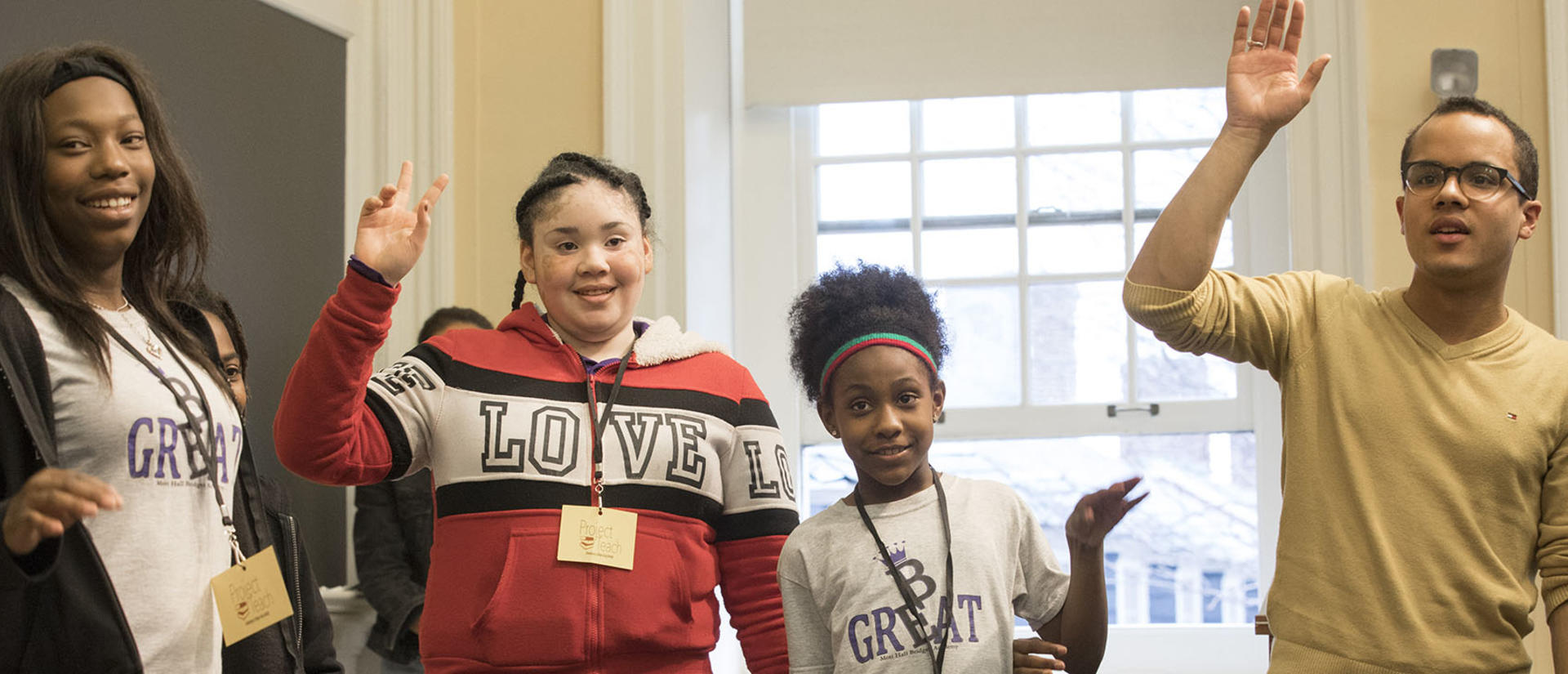 students standing smiling and looking forward